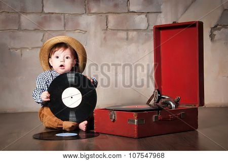 Funny Baby Boy In Retro Hat With Vinyl Record And Gramophone