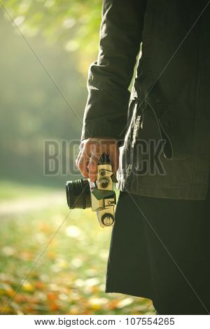 Hipster Female Photographer Exploring Autumn Nature Scenery