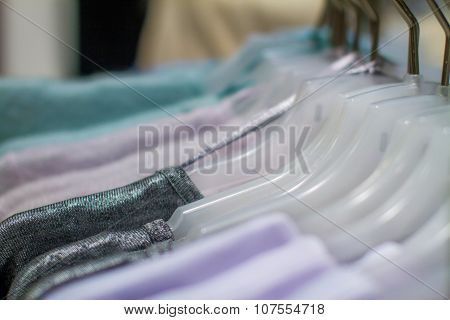 Women's Shirts Hanging On A Hanger In The Storec