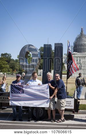 WASHINGTON DC - SEPT 11, 2015: U.S. Congressman Dave Brat (R-Va.) by the 911 Standing Tall Memorial sculpture by SteelCrazy IronArt in front of the U.S. Capitol at 2 Million Bikers to DC honor ride.