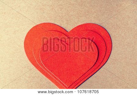 Stach of red paper heart on each other. Card for a Valentine's day