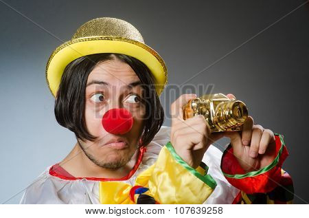 Funny clown against dark background