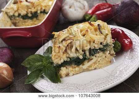 Pasticcio or pastitsio, oven baked pasta with zucchini and chard