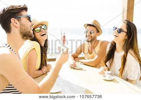 Fiends having a great time together at the beach bar