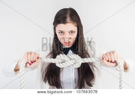 Angry businesswoman knots on rope. Problem concept