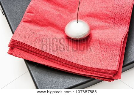 Napkin Holder With Paperweight And Red Napkins