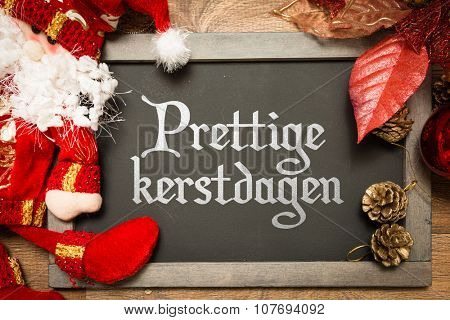Blackboard with the text: Happy Christmas (in Dutch) in a conceptual image