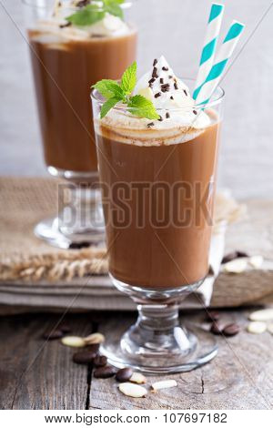 Frappuccino in a glass with cream