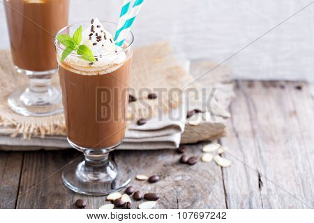 Frappuccino in a glass with cream