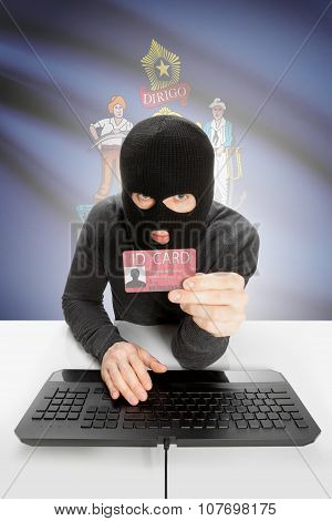 Hacker With Usa States Flag On Background And Id Card In Hand - Maine
