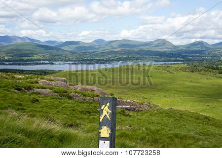 Hiking Signpost With Mountains