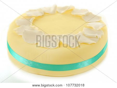 Cake with sugar paste flowers, isolated on white