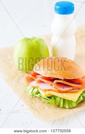 Lunch box with sandwich salad and friuts