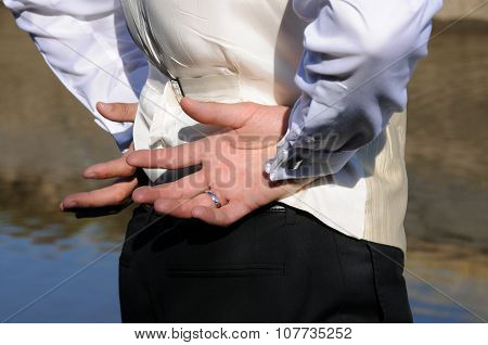 Groom hands