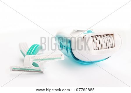 depilator and razor on white - beauty treatment