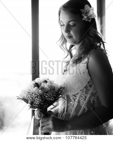 black and white portrai of bride holding a bouquet