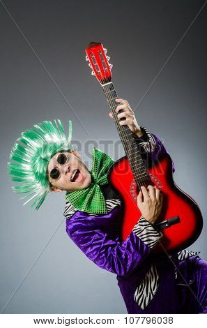 Funny man playing guitar in musical concept