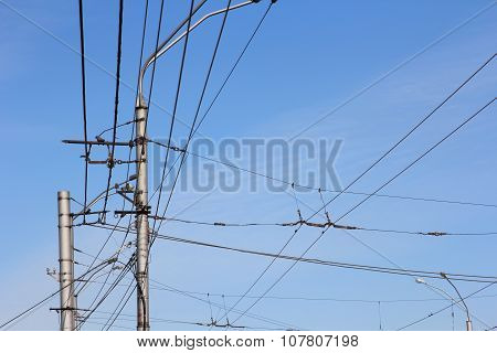 Railroad Railway Catenary Lines Against Clear Blue Sky.
