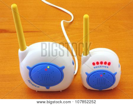 Babyphone on wooden background closeup