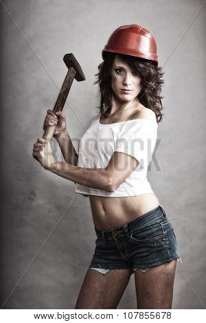 Sexy Girl In Safety Helmet Holding Hammer Tool