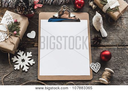 Cute vintage christmas new year gifts mock up on wooden background.
