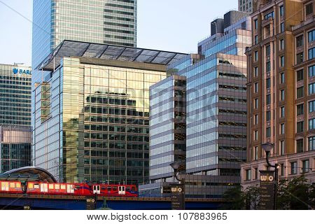 LONDON, UK - SEPTEMBER 9, 2015: DLR train running through the  Canary Wharf business and banking ari