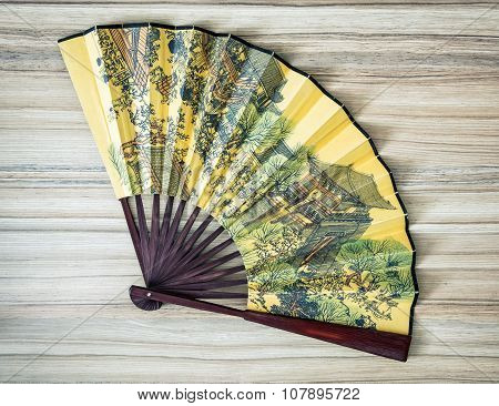Traditional Eastern Fan With Painted Artistic Pattern