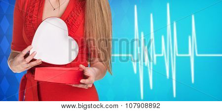 Woman present heartbox beside pulse line