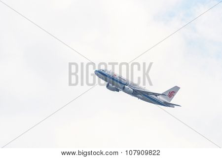 KATHMANDU, NEPAL - MARCH 2, 2014: Air China Airbus A319-115 after taking off from Tribhuvan International Airport.