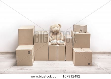 Moving boxes on the floor.