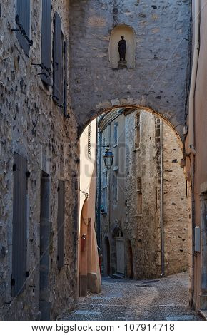 street with a gate in the medieval village