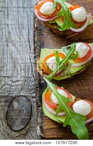Avocado mozzarella and tomato bruscetta