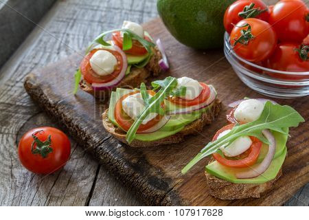Avocado mozzarella and tomato bruscetta