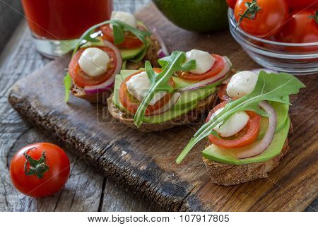 Avocado mozzarella and tomato bruscetta