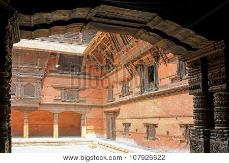 KATHMANDU, NEPAL - APRIL 2014 : Details of hand crafted wooden pillars, door and windows at Hanuman Dhoka, Old Royal Palace in Kathmandu, Nepal on 12 April 2014