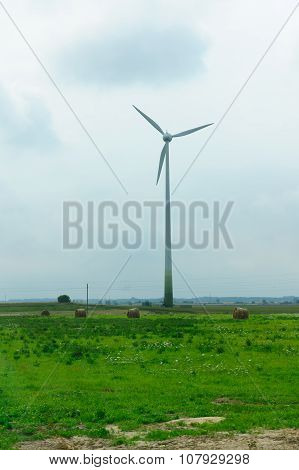 Wind-driven Generator In The Middle Of A Field