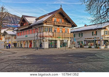 GARMISCH-PARTENKIRCHEN GERMANY - JANUARY 06 2015: Charming small Bavarian town with beautifully decorated houses on a sunny winter day. Garmisch-Partenkirchen Bavarian Alps Germany