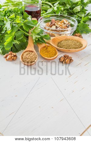 Georgian sauce ingredients on white wood background