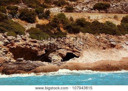 Sea landscape with high unapproachable rock 