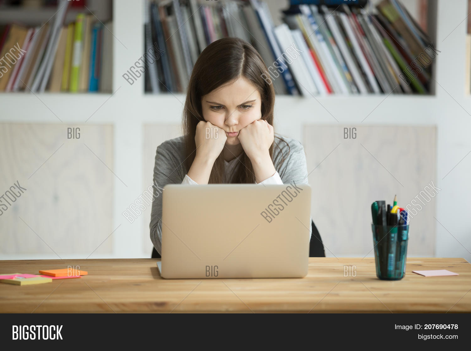 Grumpy Not Amused Office Worker Looking At Laptop Screen In Young Business Lady Bored Grumpy Not Amused Office Worker Looking At Laptop Screen In Young Business Lady Bored