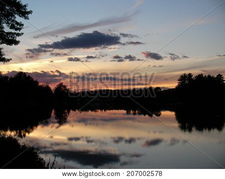 Sunset on a river, Canada in North America.