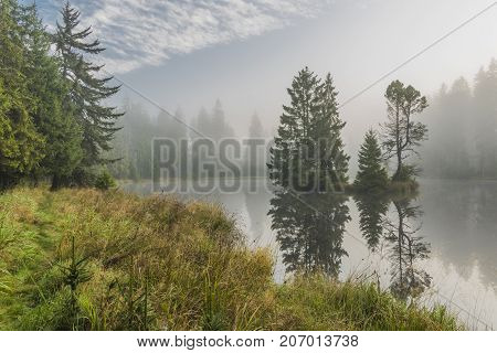 Morning fog near Bahnak ponds in autumn Kladska village