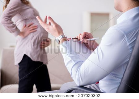 Pregnant woman visiting psychologist doctor