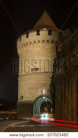 Round castle tower by the river in Lucerne