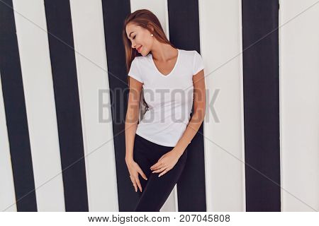 Woman with a big breast in a white T-shirt. Mock-up.