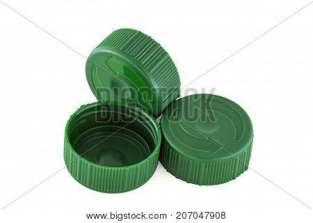 Three green plastic bottle caps isolated on white nackground
