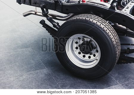 Close Up Pickup Truck Rear Tire With Car Chassis Underbody Clean New From Factory