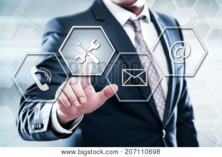 Business, technology, internet concept on hexagons and transparent honeycomb background. Businessman pressing button on touch screen interface and select technical support