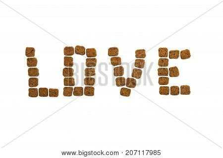 Love inscription lined with crackers on a white background
