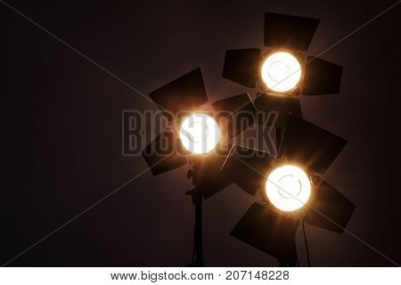 Several reflectors on the black background in photo studio. ready to do professional shooting